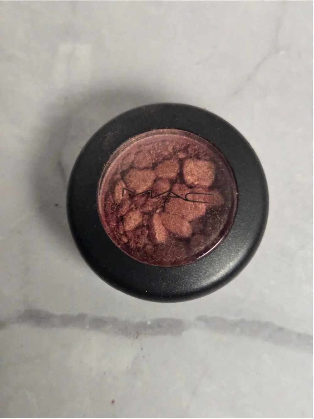 MAC Cosmetics brand Eyeshadow in the Shade Expensive Pink.
